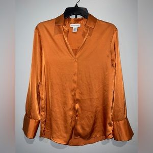 Orange blouse. Never worn. Listed as XS but fits as a medium.